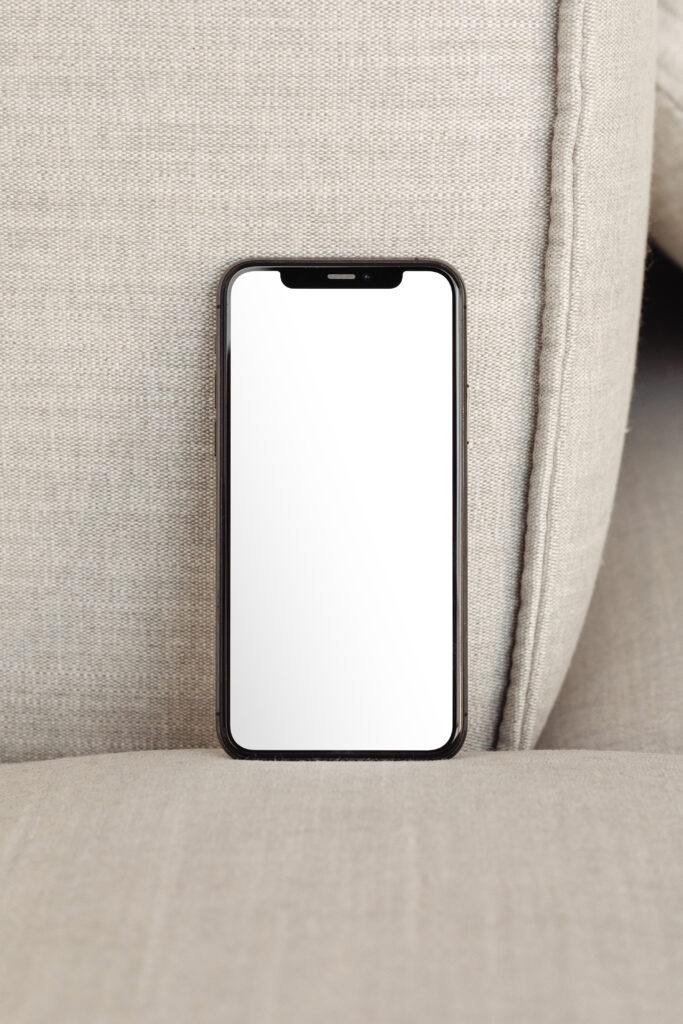Free Standing iPhone Screen Mockup - mockupbee