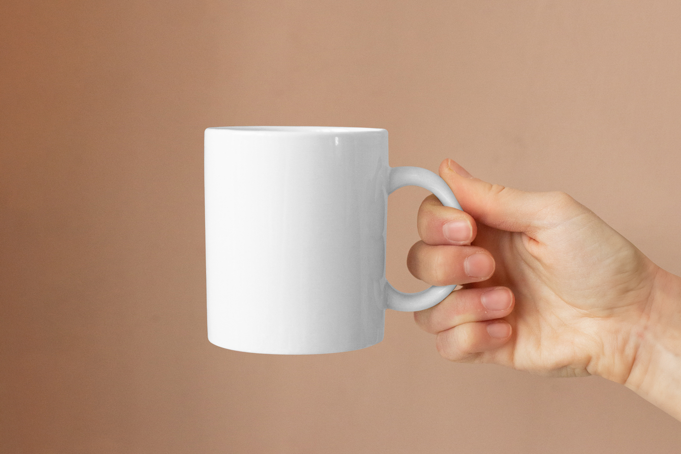 Free Ceramic Mug in Hand Mockup