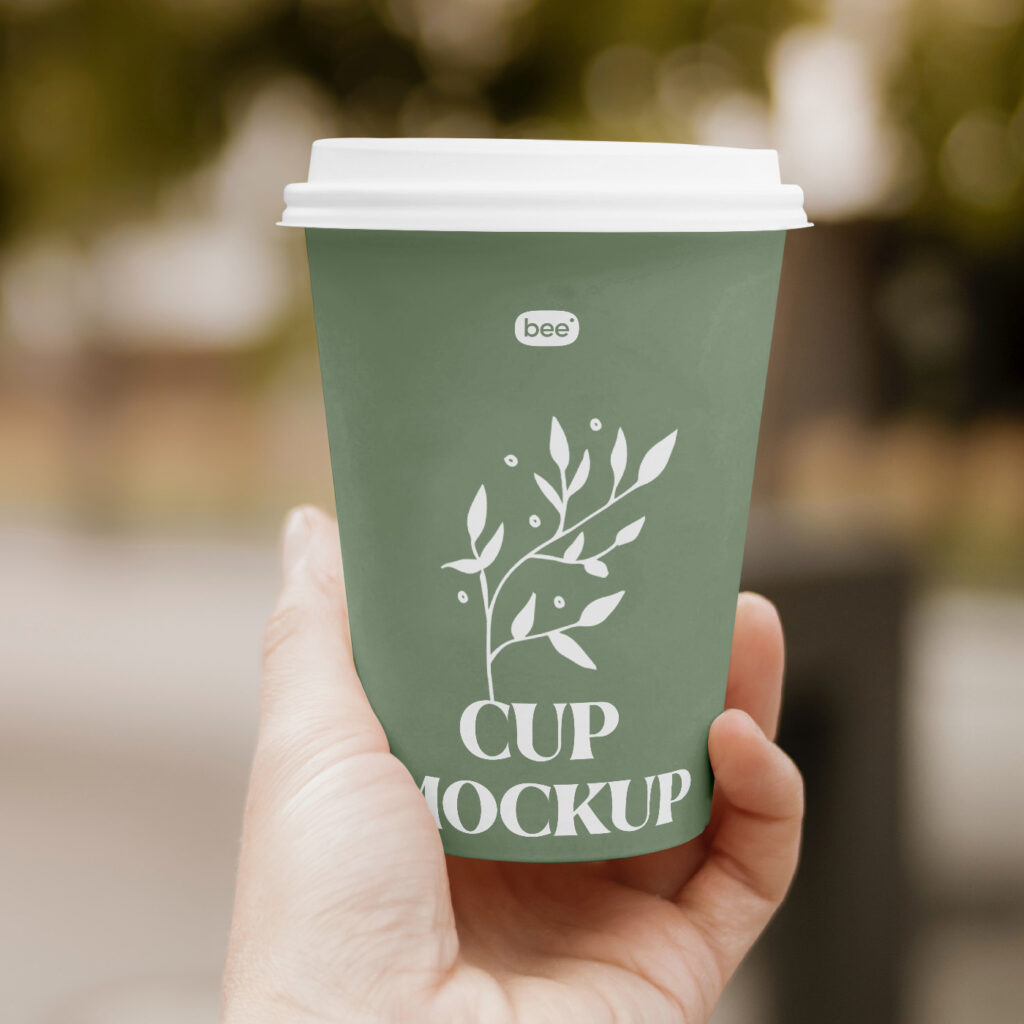 Free Paper Cup in Hand Mockup