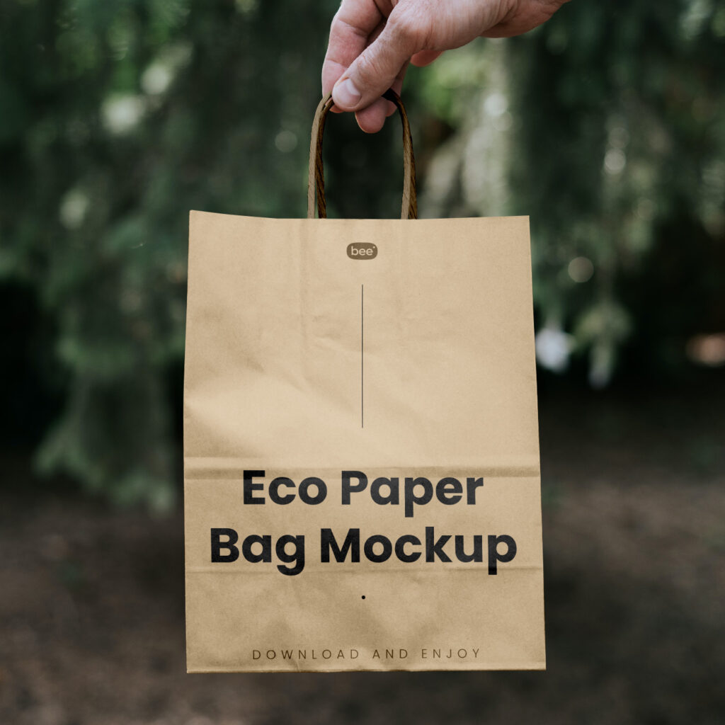 Free Paper Bag with Hand Mockup