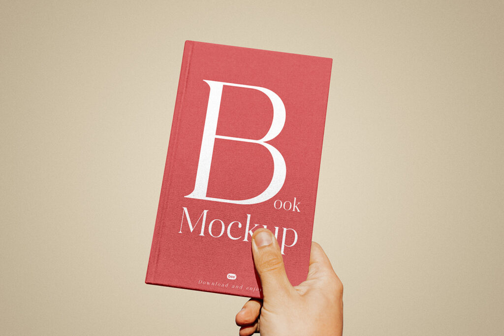 Free Book Cover in Hand Mockup