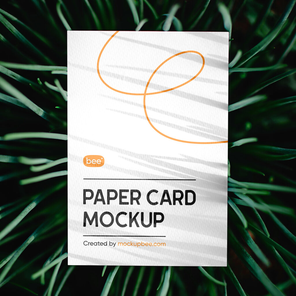 Free Paper Card in Grass Mockup
