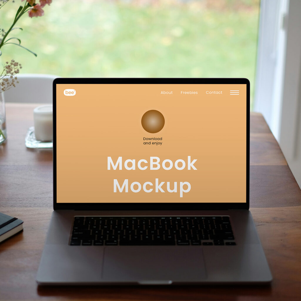 Free MacBook on Table Mockup - mockupbee