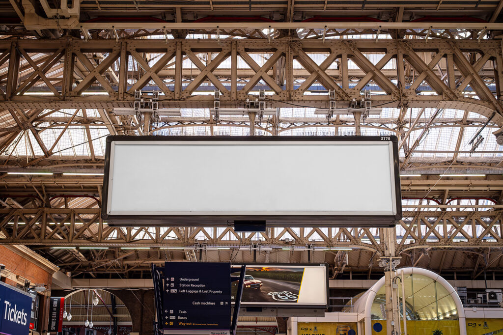 Free Victoria Station Billboard Front View Mockup - mockupbee