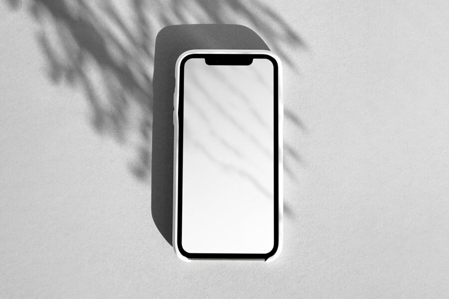 Free iPhone Screen in Shadow Mockup - mockupbee