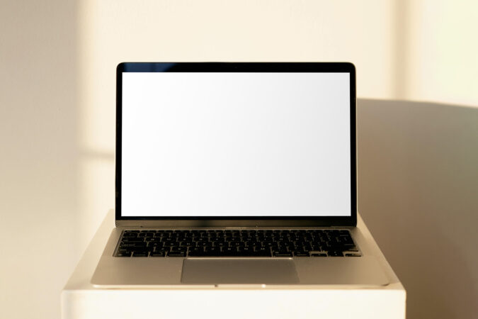 Free MacBook Screen on Coffee Table Mockup - mockupbee