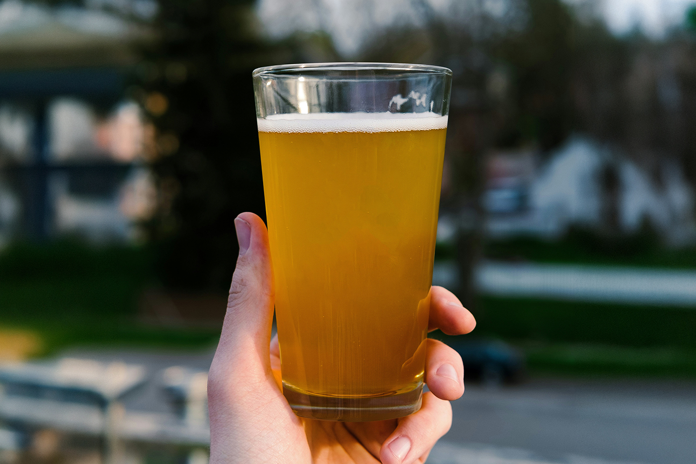 Free Beer Glass in Hand Mockup