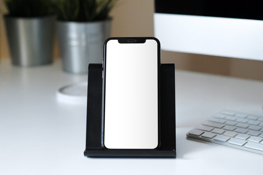 Free iPhone in Stand Mockup - mockupbee