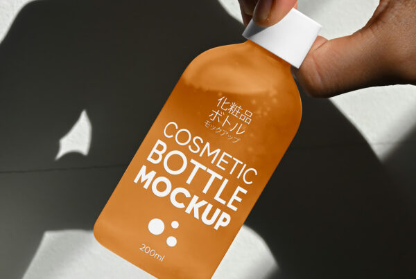 Free Cosmetic Glass Bottle in Hand Mockup
