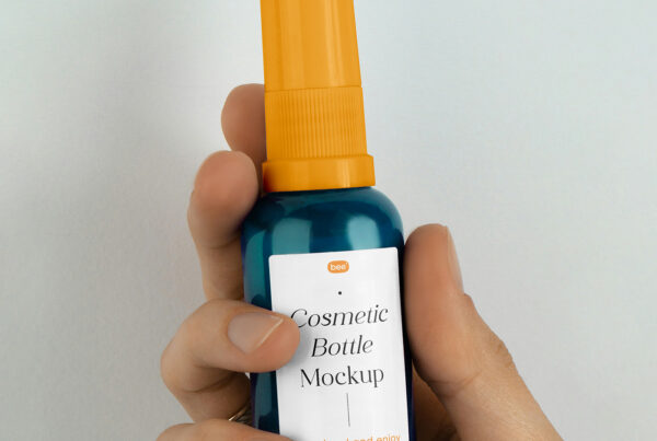 Free Small Spray Bottle in Hand Mockup